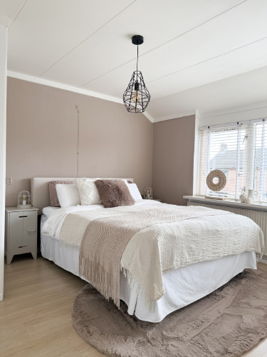 Slaapkamer in tussenwoning Putten